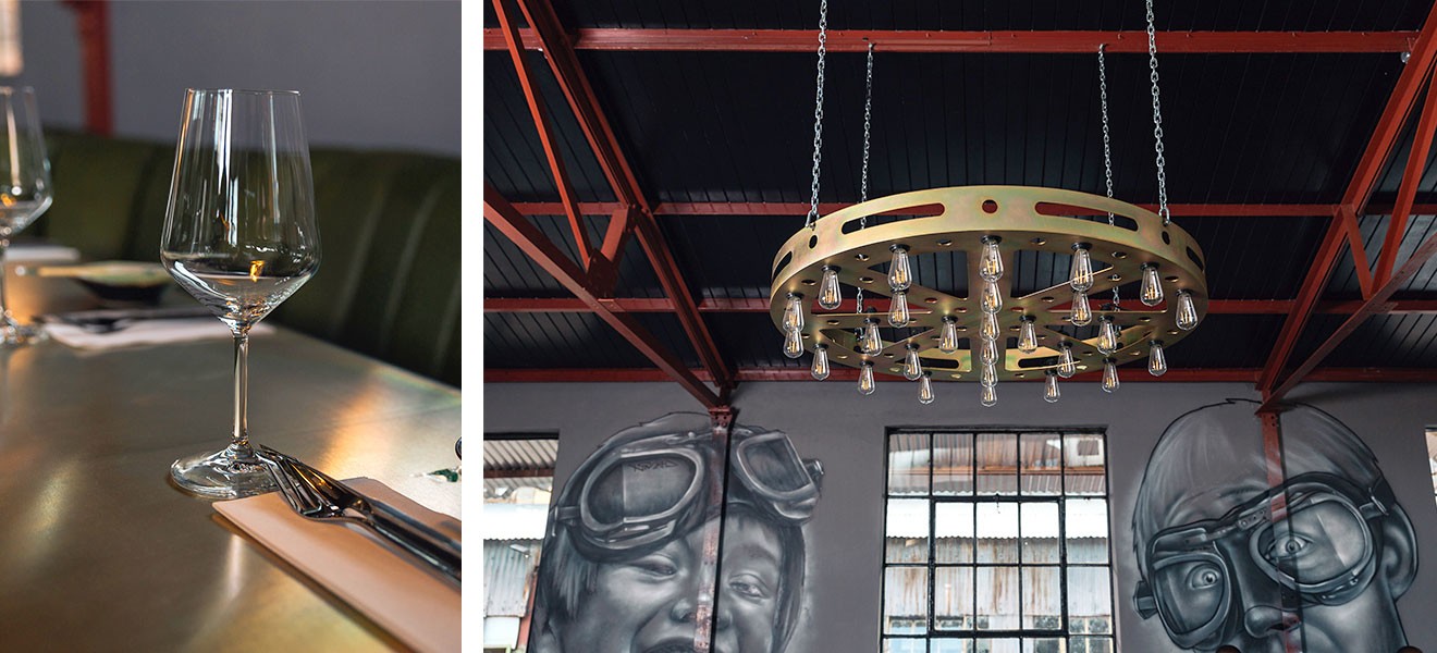 The walls along the length of the brewery feature grey-scale murals by graffiti artist Nomad, including one of two children wearing goggles.